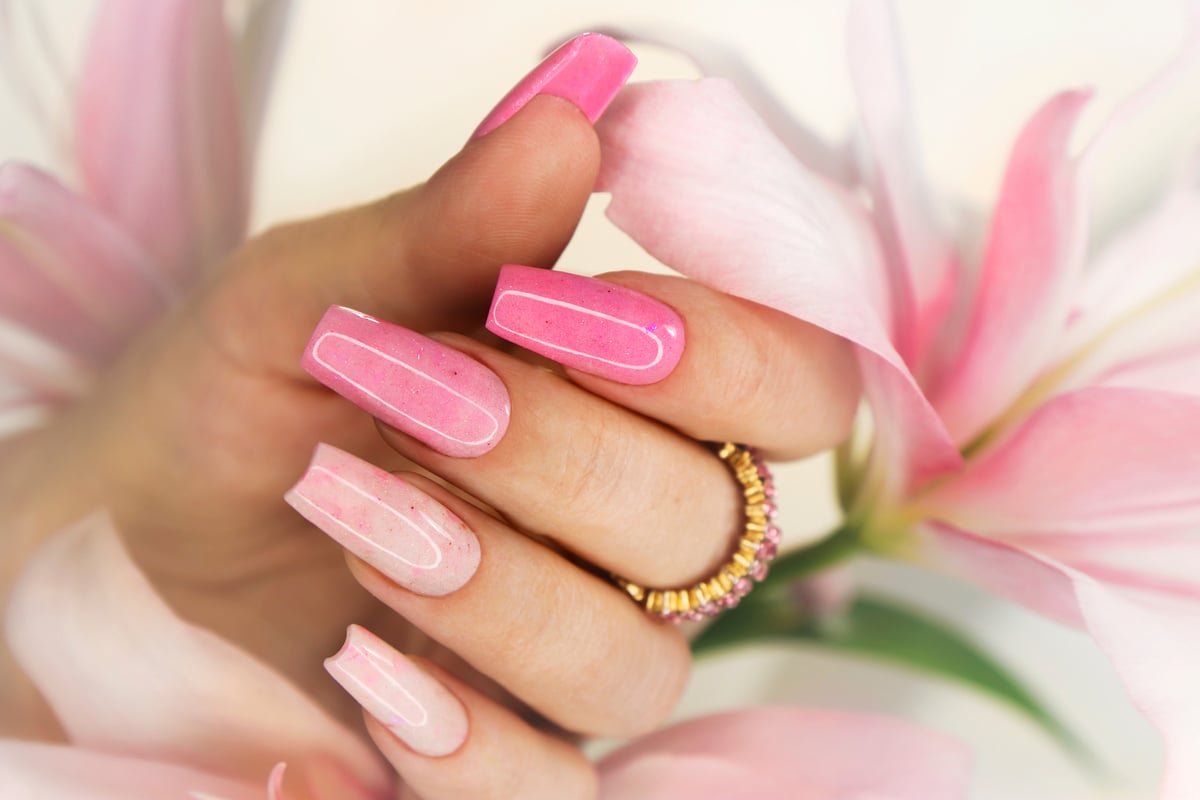 Pink elongated nail extension.